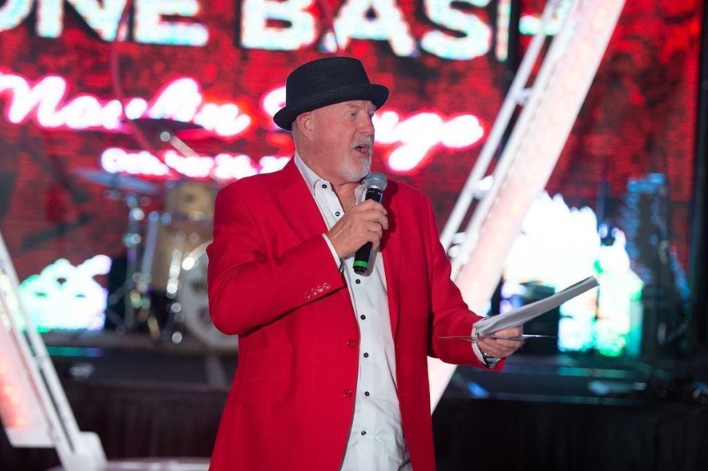 auctioneer performs live charity auction